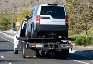 suv being towed by a tow truck